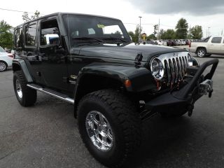 2011 Jeep Wrangler Unlimited Sahara Sport Utility 4 - Door 3.  8l With 4 Inch Lift photo