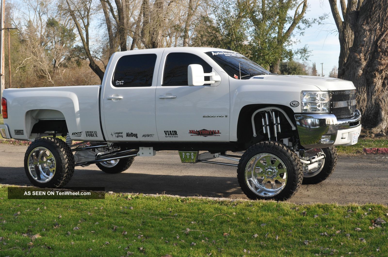 Lifted White Silverado With Rockstars