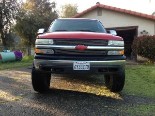 2002 Chevy Silverado 1500ls Red 7in Cst Lift photo