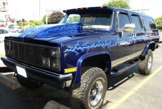 1986 Air Brushed Pearl Blue Suburban Reborn As A Lifted Custom Hot Rod Truck photo