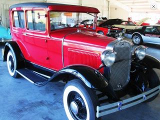 Red And Black Ford Model A 1930 With Tan Interior photo